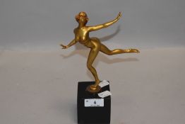 An art deco gilt bronze figurine depicting nude dancing lady on black marble base, possibly '