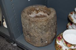 A substantial carved stone mortar.