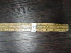 A vintage wooden meter rule advertising Burgh upholstery fabrics