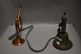 An antique hand bell having internal clapper and added extra external clapper sold with a small