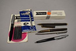 A Platignum varsity cartridge fountain pen with four refills, a Papermate 'Replay' refill (