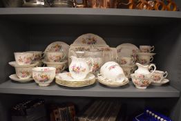 A Coalport 'Junetime' part tea service,having floral transfer pattern to include plates,teapot,