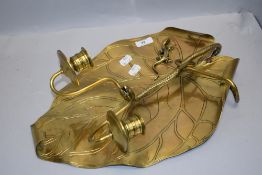A large early 20th century polished brass wall sconce having arts and crafts styling,with serpent