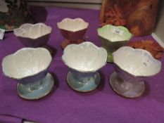 A set of six 1940s Maling ware tulip shaped fruit or sundae dishes having harlequin lustre