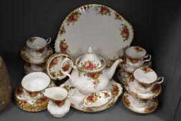 A collection of Royal Albert old country roses tableware including tea pot, platter,sugar,cream