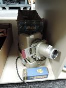 A vintage Aldis colour slide projector, with original card packaging.
