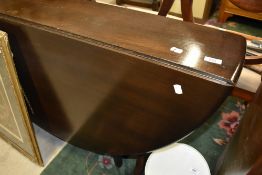 A dark stained Ercol drop gate leg table , in the Sutherland style, open size approx 140 x 12cm
