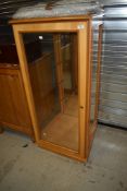 A shop style beech display cabinet, dimensions approx. 60 x 60 x 130cm