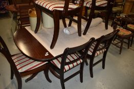 A reproduction Regency mahogany dining table and set of eight (six plus two) chairs