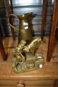 A brass model of blacksmith and a brass jug