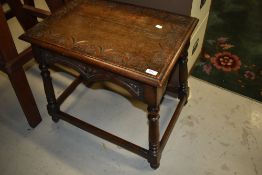 A 19th Century oak occasional table having lunette carving on turned splay legs, approx. 63 x 43cm