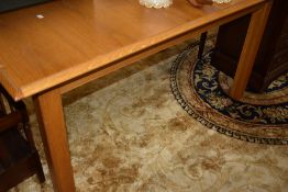 A modern/vintage oak dining table, marked for St Michael/Marks and Spencer, with integral