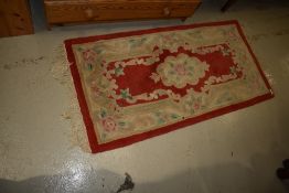 A Chinese fireside rug, approx. 120 x 60cm