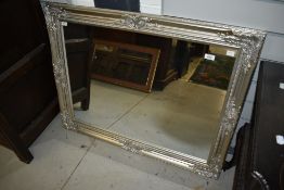 A modern silvered wood frame mirror, approx. 90 x 70cm