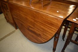 A Victorian mahogany drop leaf dining table having turned legs