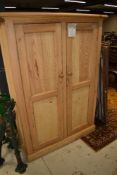 A 19th Century , later stripped, pine cabinet having shelved interior, dimensions approx. W110 D40