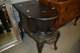 A traditional cast iron wood burning stove, in nice condition, looks to have had little or no use (