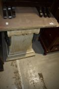 A composite garden table having sandstone top , in the classical style