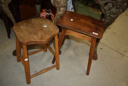 Two traditional stools, milking style (four legged , one with stretchers and shaped top)
