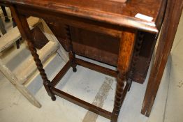 An early 20th Century oak occasional table having barley twist legs, approx. 58 x 39cm