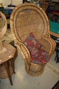 A vintage wicker peacock style chair