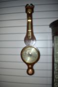 A 19th Century mahogany cased barometer having humidity and thermometer dials, silvered main dial