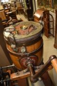 A traditional butter churn on stand