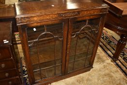 An early 20th Century oak low bookcase, width approx. 91cm