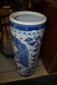 A reproduction Oriental blue and white stick stand having crane decoration, dynasty style marks to