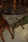 A traditional Britannia pub table having wooden circular top