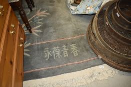 A Chinese carpet square, in jade ground, approx. 264 x 186cm