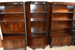 A set of reproduction Regency bookcases, including corner section