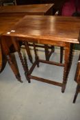 An early 20th Century oak occasional table having twist leg, width approx. 58cm