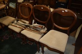 A set of four Victorian mahogany balloon back dining chairs