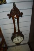 A late 19th Century oak cased aneroid barometer