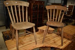 A pair of traditional beech kitchen chairs