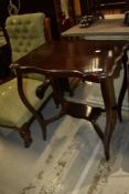A Victorian mahogany occasional table having shaped top and undertier