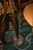 A traditional oak standard lamp