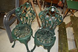 A pair of cast aluminium and powder coated garden chairs