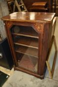 A 19th Century walnut music sheet music cabinet having glass front