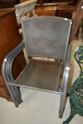 A set of four modern metal garden chairs