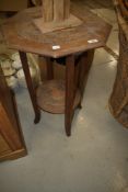 A carved occasional table