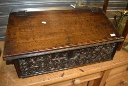 A period oak bible box/desk having carved decoration and date to front , width approx. 70cm