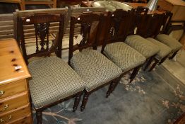 A set of six 19th Century mahogany salon/dining chairs having later upholstered seats and turned