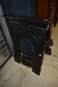 A cast iron fire surround etc