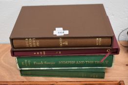A collection of four fishing related books in cardboard sleeves. 2 by smith settle and another ltd