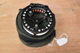 A Loop dryfly fly reel in unmarked soft case