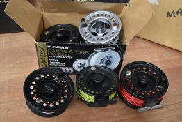 A Luseflash Mamba reel with 2 spare spools. A Lureflash highland spirit with spare spool and another