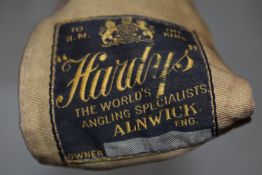 A Vintage Hardy 3 pc cane rod in original sleeve un-named but heavily branded patent steel center