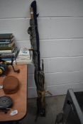 A selection of vintage fishing rods with fly reel and a landing net
